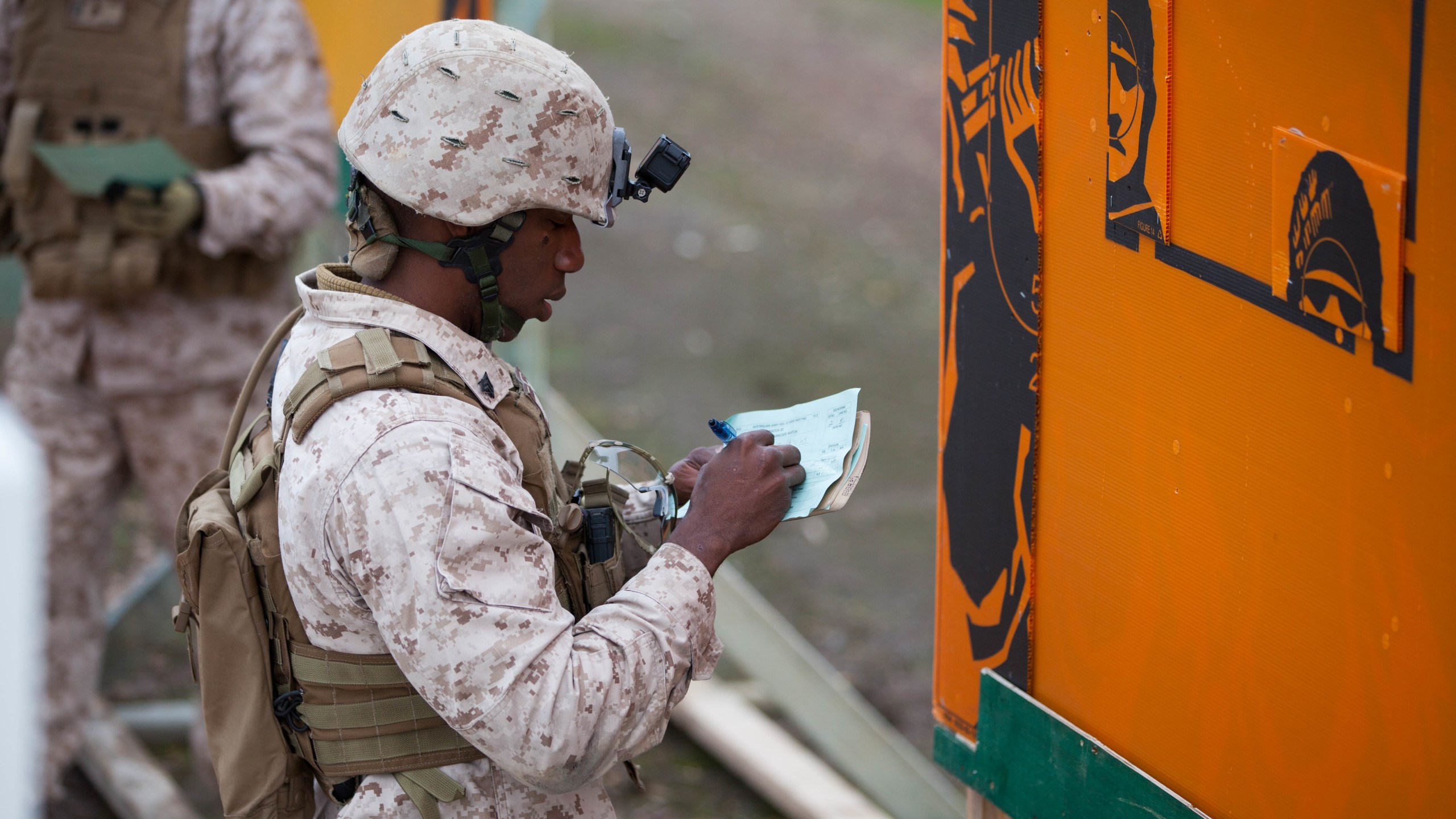 Sgt. Jacques Yves Duroseau grades a competitor’s score after the barricade match at Puckapunyal Military Area, Victoria, Australia, on May 11, 2016. (Credit: Sgt. Terry Brady/U.S. Marine Corps)