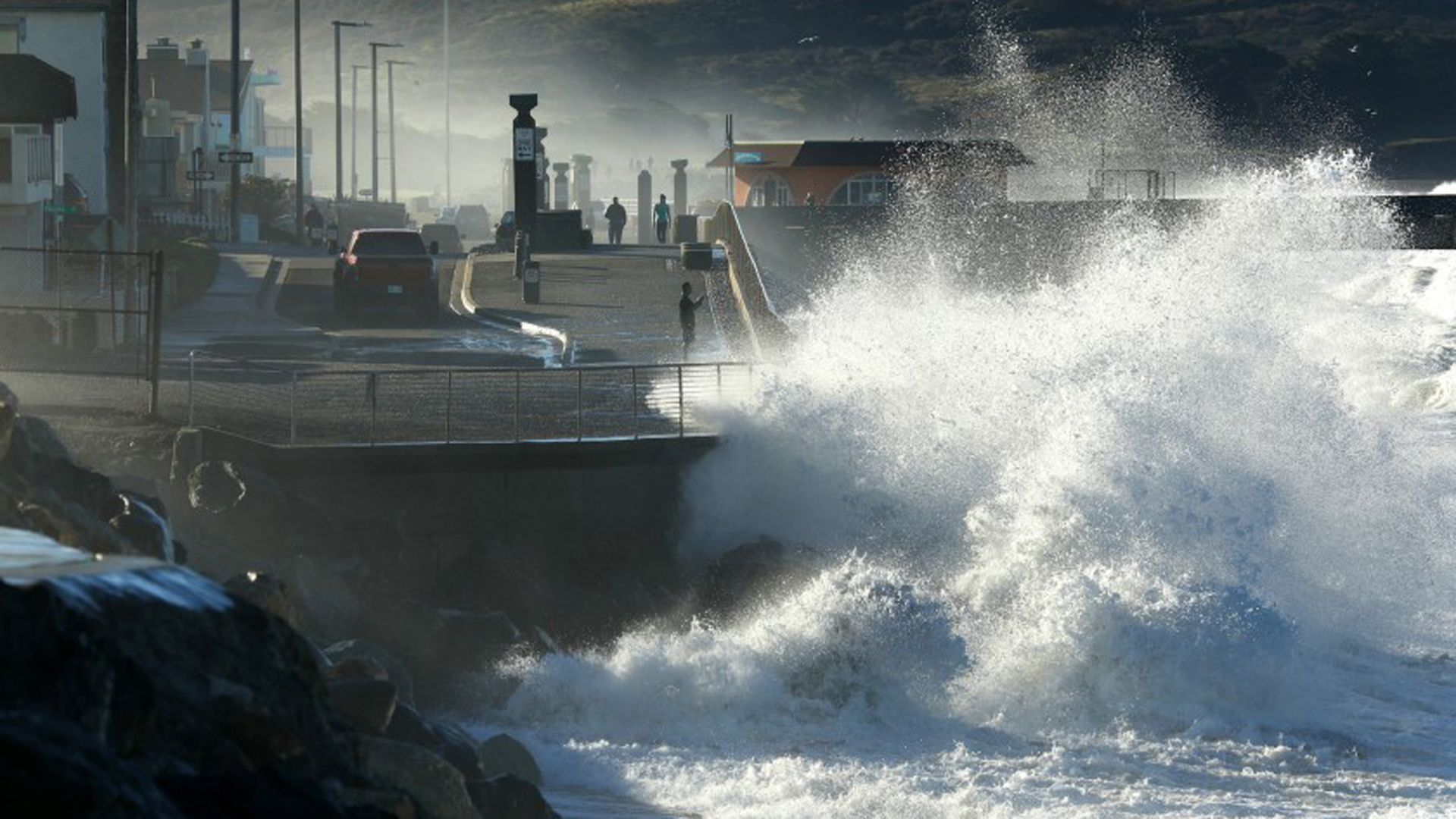 A wave pounds the shores of Pacifica during high tide. Cities up and down the California coast are grappling with the costs and consequences of living by the sea.(Credit: Carolyn Cole / Los Angeles Times)