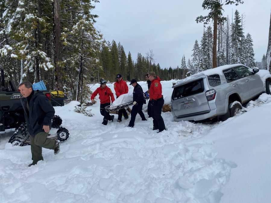 Paula Beth James is rescued from her snow-covered car on Jan. 15, 2020, after having been missing for six days in Butte Meadows. (Credit: Butte County Sheriff's Office.)