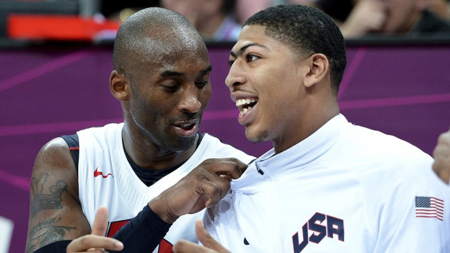 Kobe Bryant, left, and Anthony Davis talk while sitting on the bench during a game at the 2012 London Olympics.(Credit: Wally Skalij / Los Angeles Times)