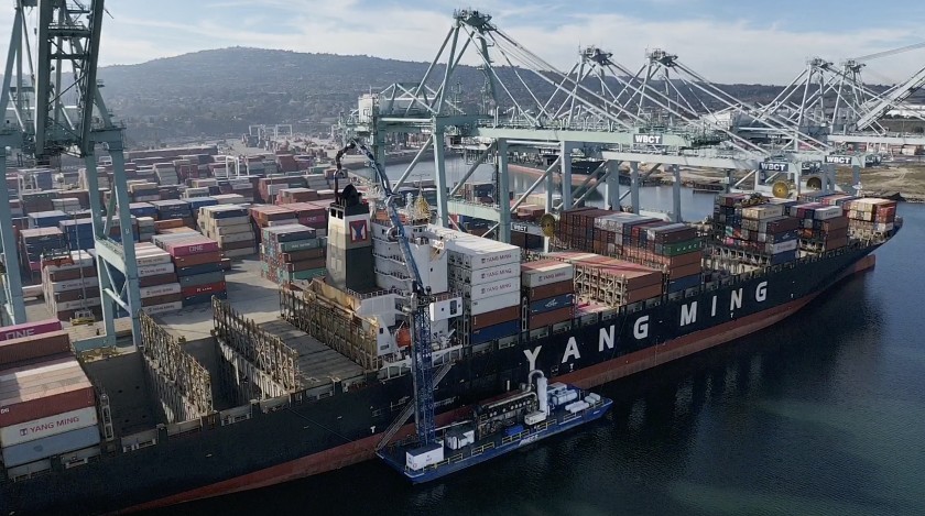 A barge at the Port of Los Angeles uses a system, known as a bonnet or “sock on a stack,” that’s intended to scrub exhaust in December 2019. (Credit: Allen J. Schaben / Los Angeles Times)