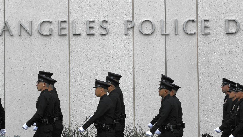 Several LAPD officers are seen outside the station in this undated photo. (Brian van der Brug / Los Angeles Times)