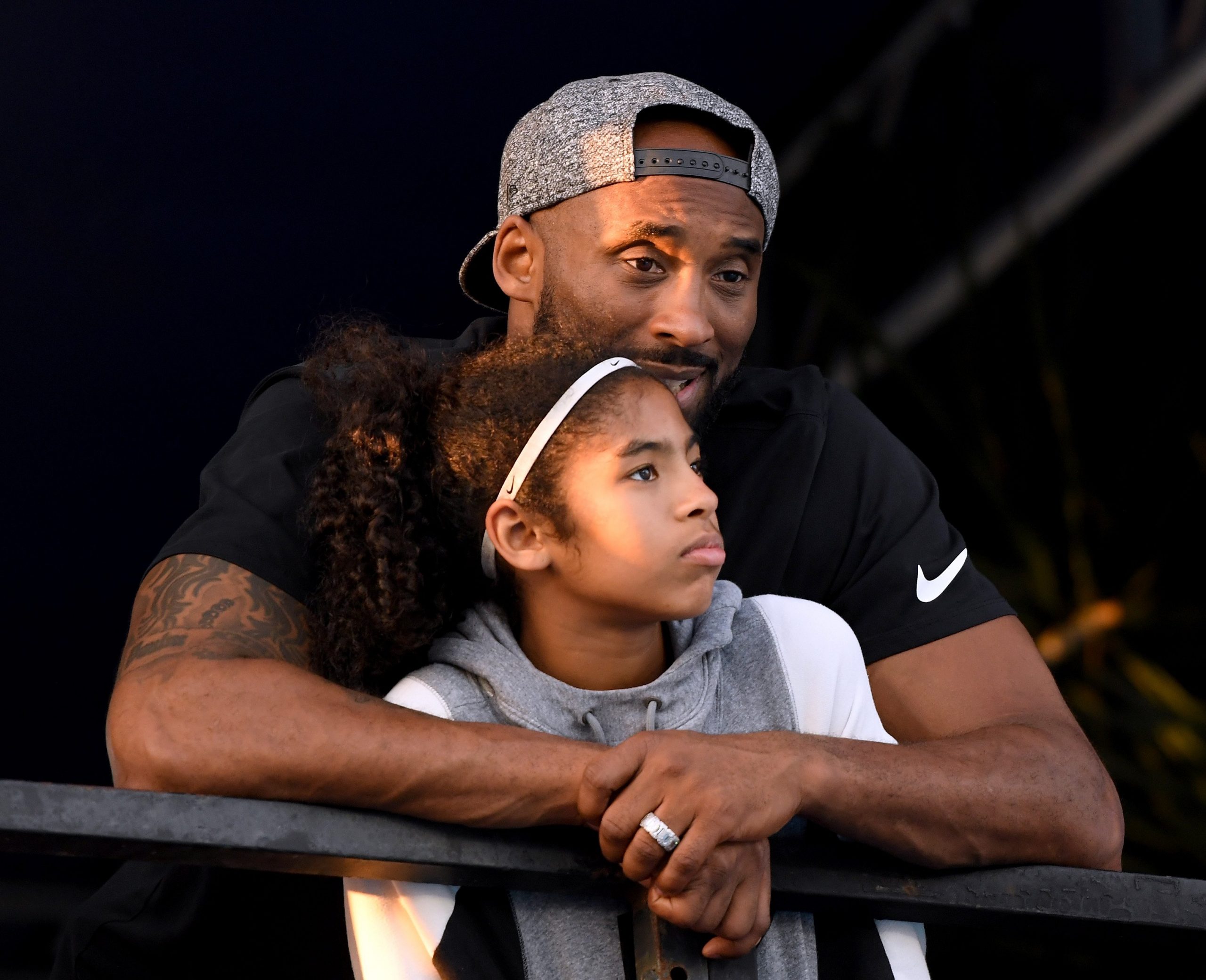 Kobe Bryant and daughter Gianna Bryant watch the Phillips 66 National Swimming Championships at the Woollett Aquatics Center on July 26, 2018, in Irvine. (Photo by Harry How/Getty Images)