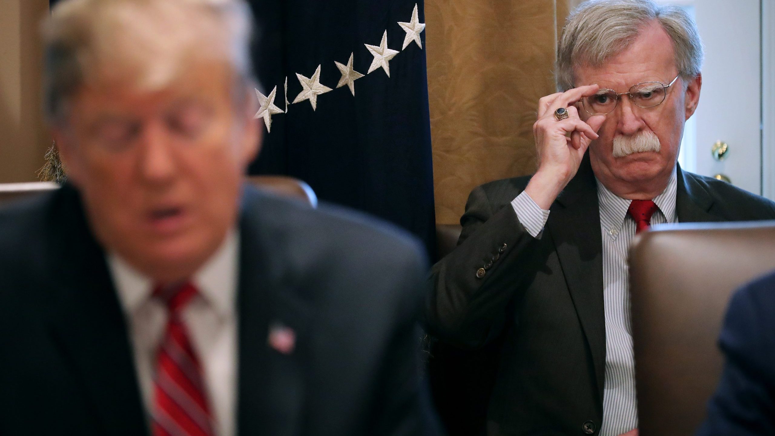 Then-National Security Advisor John Bolton, right, listens to. President Donald Trump talk to reporters during a meeting of his cabinet in the Cabinet Room at the White House on Feb. 12, 2019. (Chip Somodevilla/Getty Images)