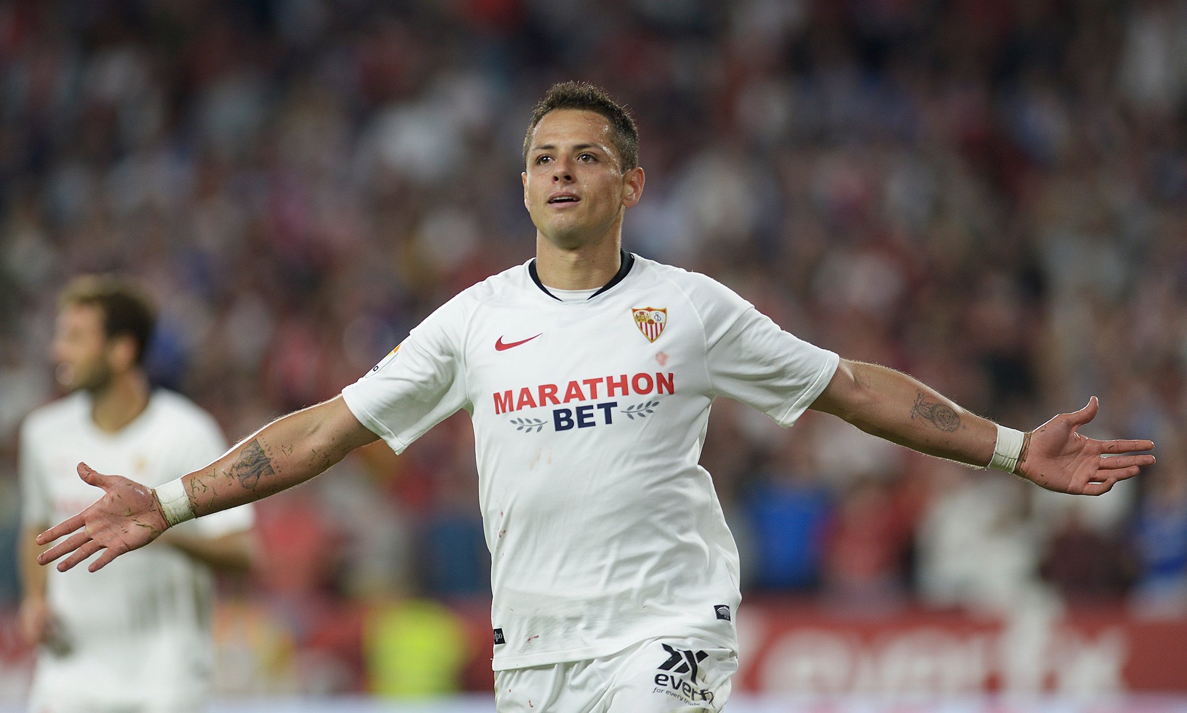 Sevilla's Mexican forward Javier "Chicharito" Hernandez celebrates after scoring a goal during the Spanish league football match between Sevilla FC and Getafe CF in Seville on Oct. 27, 2019. (Credit: Cristina Quicler / AFP / Getty Images)