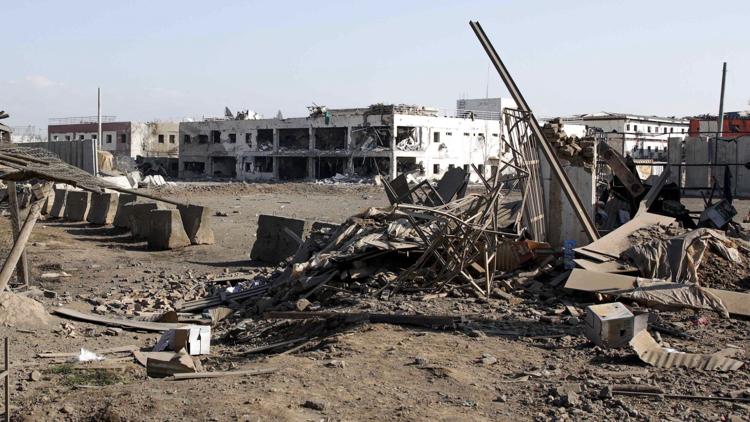 Damaged buildings are pictured at the scene of a car bombing near the largest U.S. military in Afghanistan, north of Kabul in Parwan province, on Dec. 11, 2019. (Credit:STR/AFP via Getty Images)