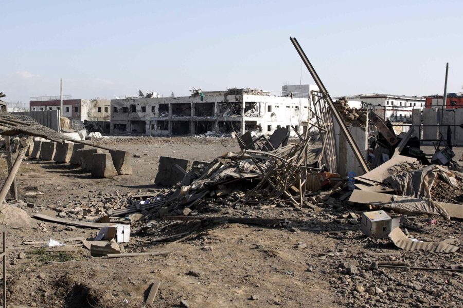 Damaged buildings are pictured at the scene of a car bombing near the largest U.S. military in Afghanistan, north of Kabul in Parwan province, on Dec. 11, 2019. (Credit:STR/AFP via Getty Images)