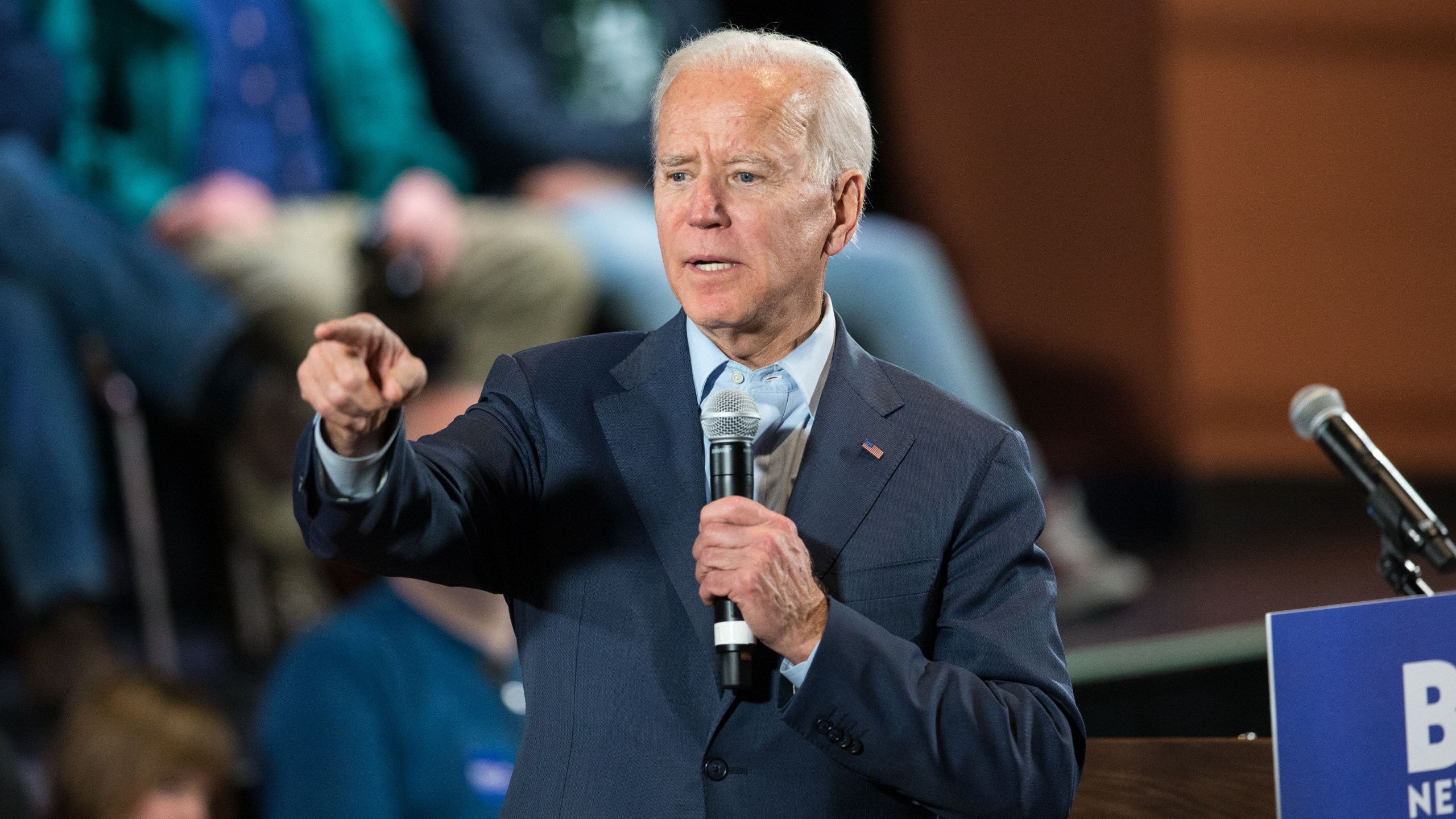 Democratic presidential candidate, former Vice President Joe Biden points to a member of the crowd who wanted to ask a question during a campaign Town Hall on Dec. 30, 2019 in Derry, New Hampshire. (Credit: Scott Eisen/Getty Images)