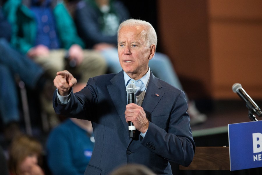 Democratic presidential candidate, former Vice President Joe Biden points to a member of the crowd who wanted to ask a question during a campaign Town Hall on Dec. 30, 2019 in Derry, New Hampshire. (Credit: Scott Eisen/Getty Images)