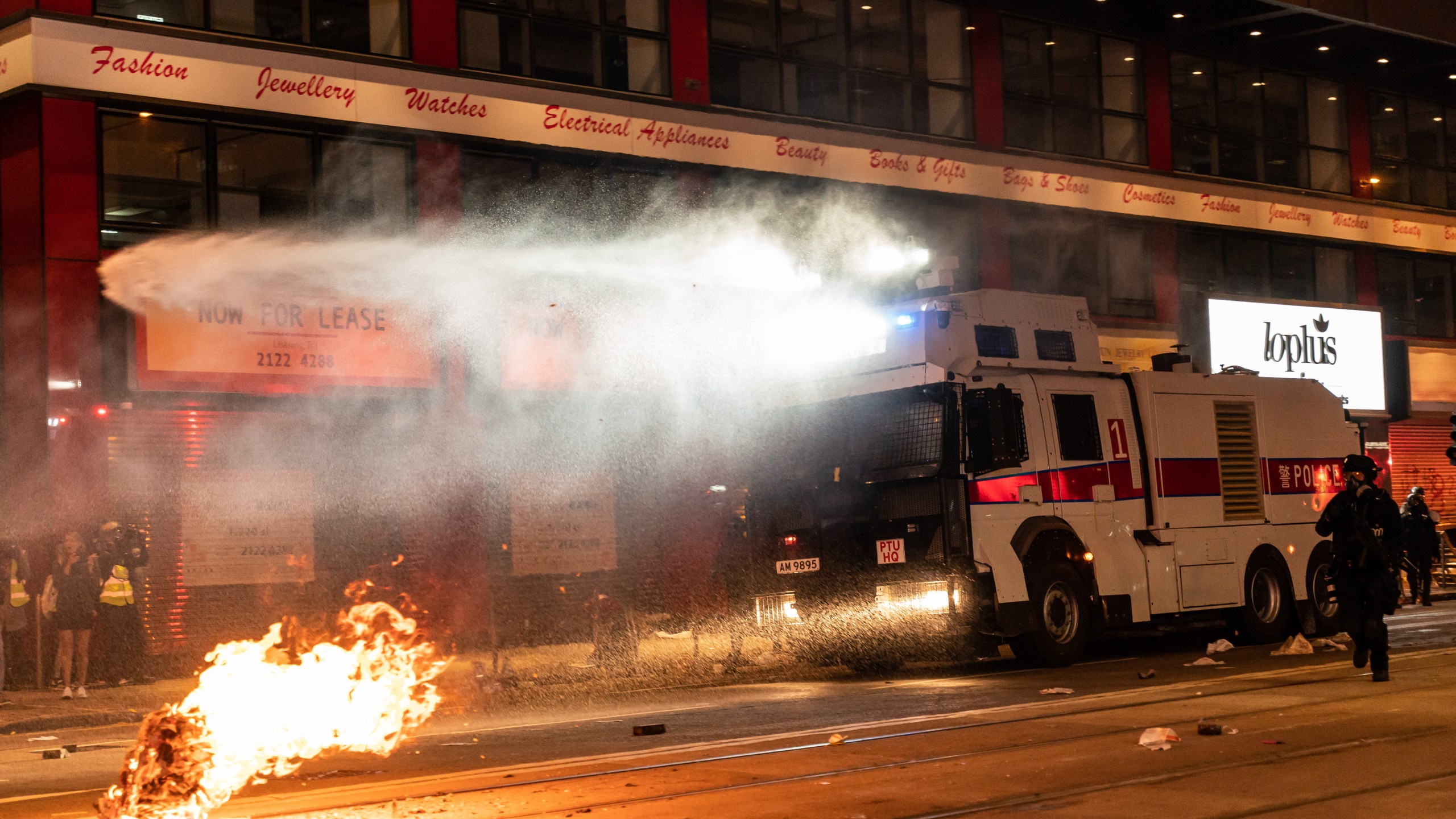 Police deploy a water canon vehicle to disperse protesters in Causeway Bay district during a rally on New Years Day on January 1, 2020, in Hong Kong. (Credit: Anthony Kwan/Getty Images)