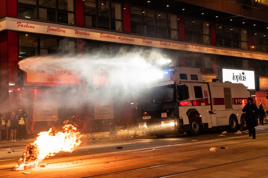 Police deploy a water canon vehicle to disperse protesters in Causeway Bay district during a rally on New Years Day on January 1, 2020, in Hong Kong. (Credit: Anthony Kwan/Getty Images)