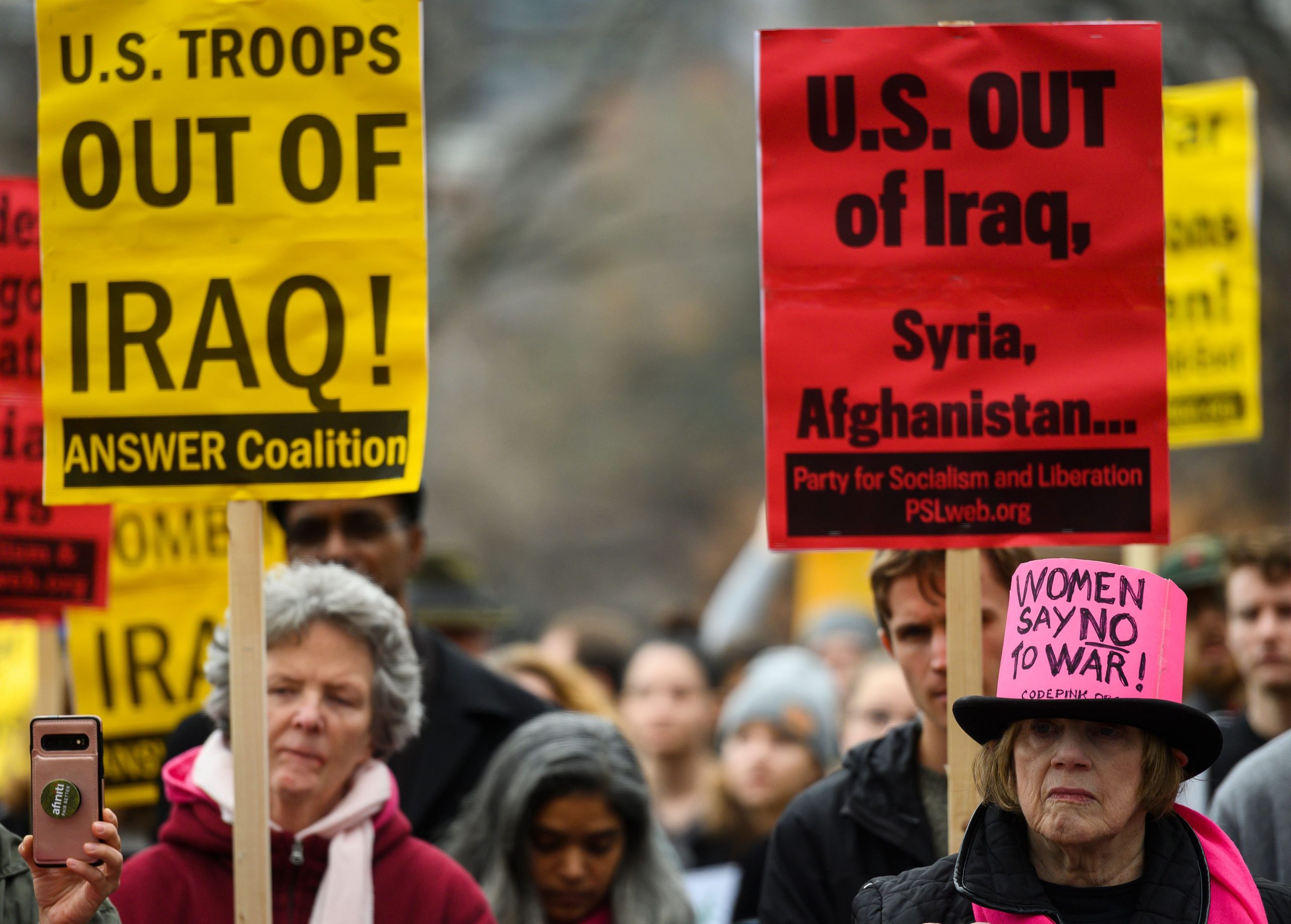 Anti-war activists march from the White House to the Trump International Hotel in Washington, DC, on Jan. 4, 2020. (Credit: Andrew Caballero-Reynolds / AFP / Getty Images)