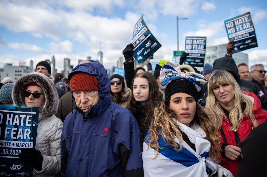 People participate in a Jewish solidarity march across the Brooklyn Bridge in New York City on Jan. 5, 2020. (Credit: Jeenah Moon / Getty Images)