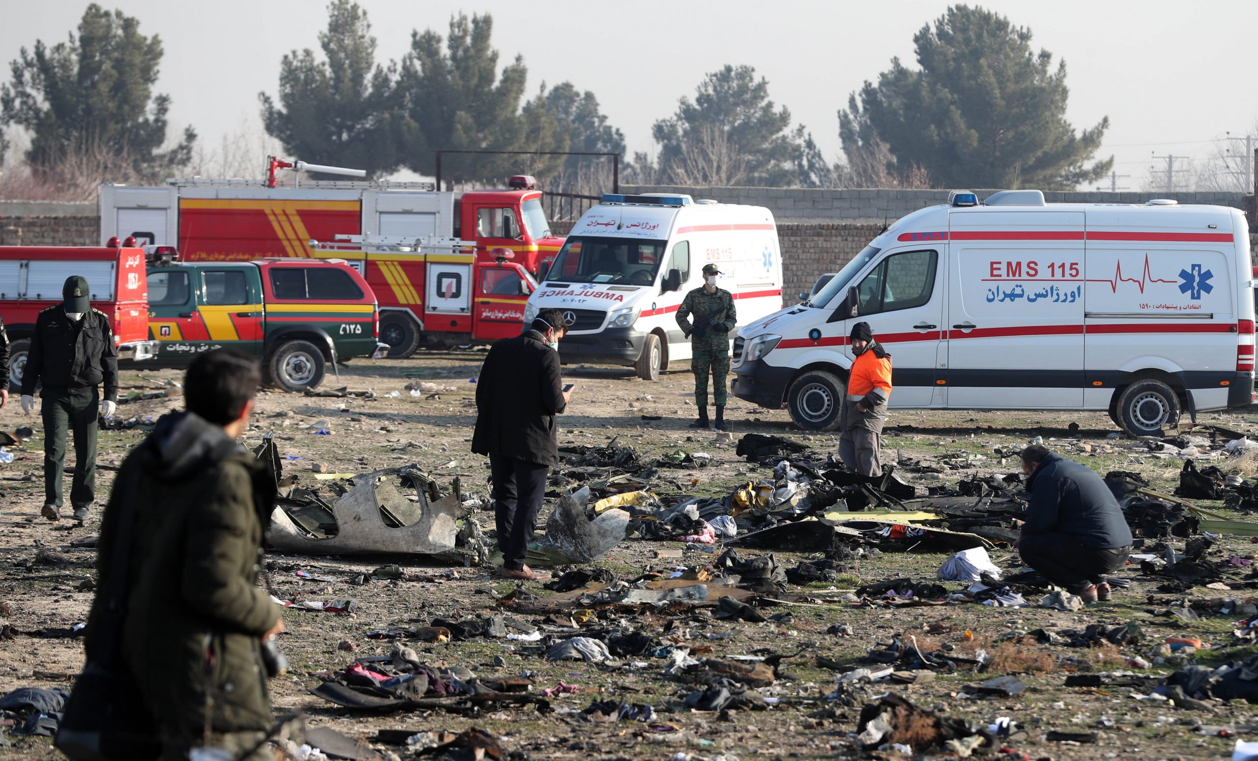 Rescue teams assess the wreckage after a Ukrainian plane carrying 176 passengers crashed near Imam Khomeini Airport in the Iranian capital Tehran early in the morning on Jan. 8, 2020. (Credit: AFP via Getty Images)