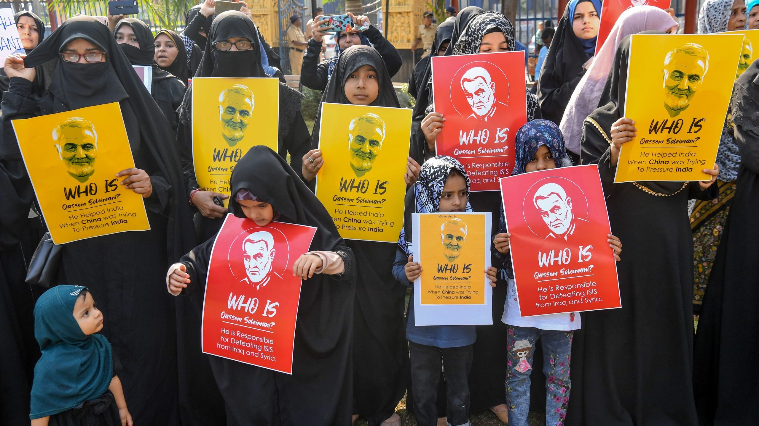 Demonstrators hold posters showing Iranian general Qassem Soleimani to protest against U.S. military action that killed the general in Iraq on Jan. 9, 2020, in Mumbai. (Credit: INDRANIL MUKHERJEE/AFP via Getty Images)