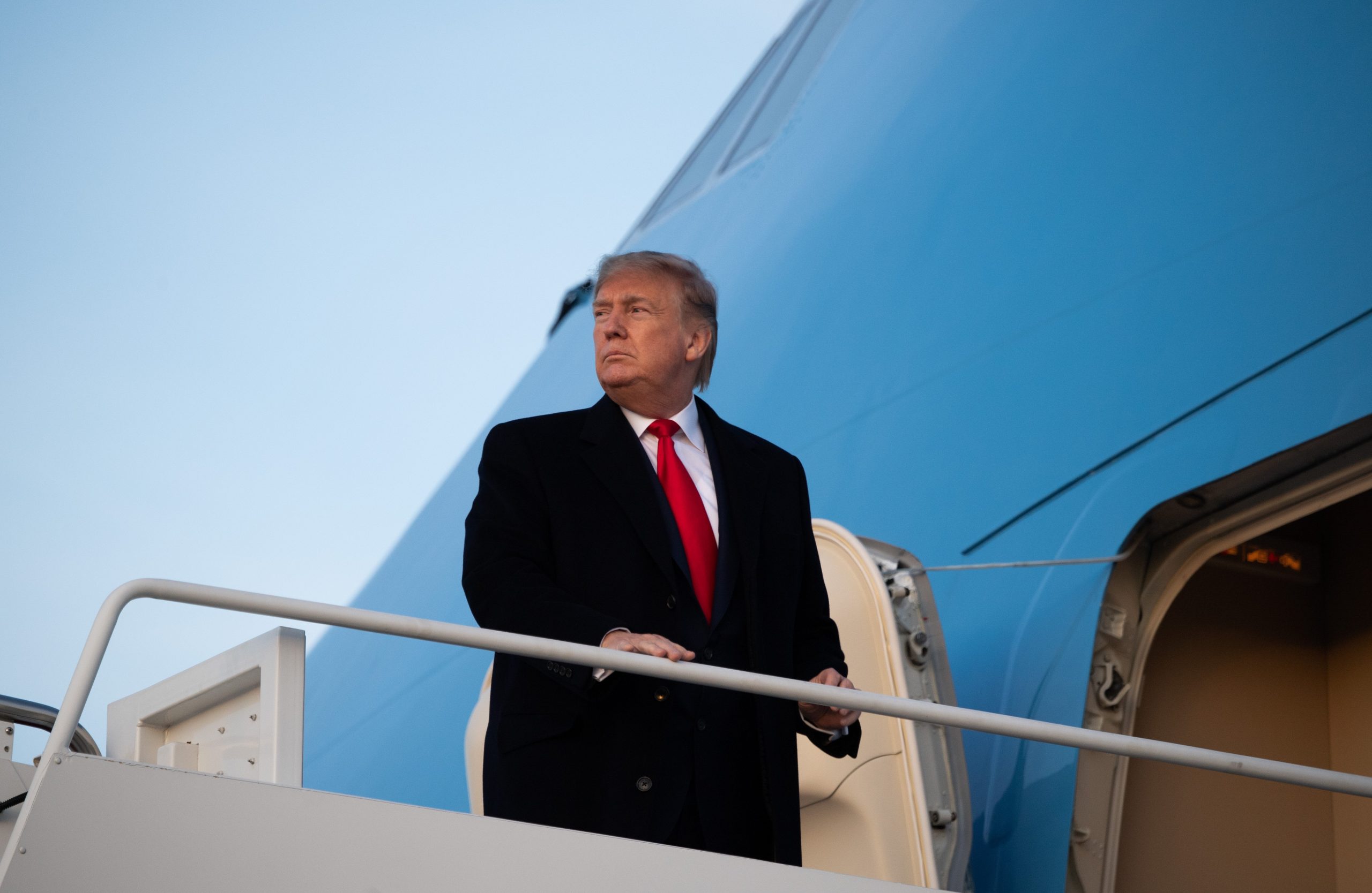 President Donald Trump boards Air Force One prior to departure from Joint Base Andrews in Maryland on Jan. 9, 2020, headed to a campaign rally in Toledo, Ohio. (Credit: Saul Loeb / AFP / Getty Images)