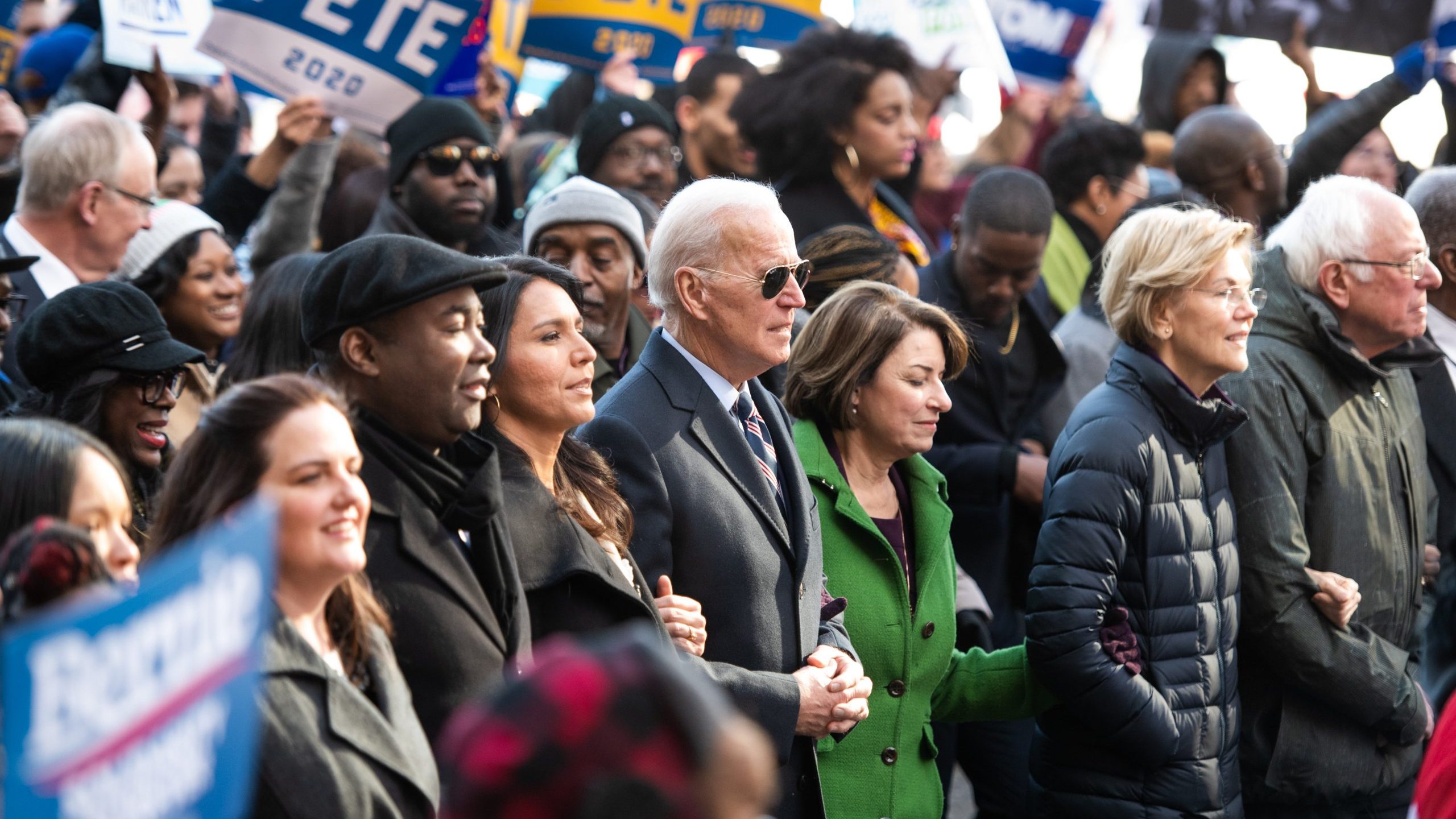 Democratic presidential candidates, Rep. Tulsi Gabbard (D-HI), left, former Vice President Joe Biden, Sen. Amy Klobuchar (D-MN), Sen. Elizabeth Warren (D-MA), and Sen. Bernie Sanders (I-VT), right, march to the King Day event on Jan. 20, 2020, in Columbia, South Carolina. (Credit: Sean Rayford/Getty Images)