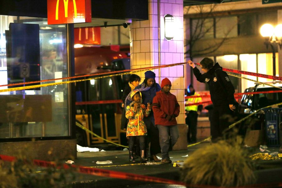 People are escorted by police away from the scene of a shooting in Seattle's central business district on Jan. 22, 2020. (Credit: Karen Ducey / Getty Images)