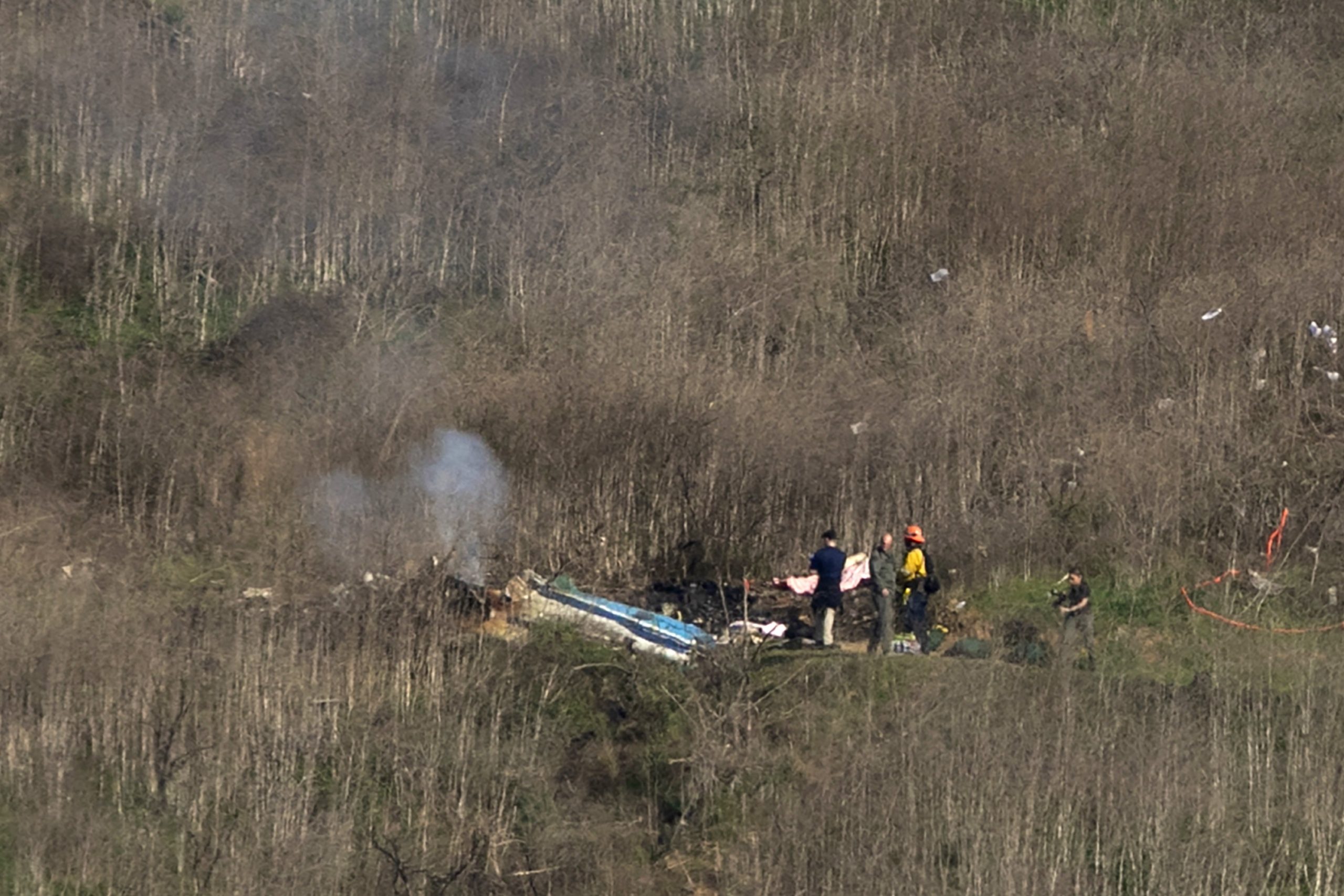 Investigators work at the scene of a helicopter crash that killed former NBA star Kobe Bryant on Jan. 26, 2020, in Calabasas. (Credit: David McNew/Getty Images)