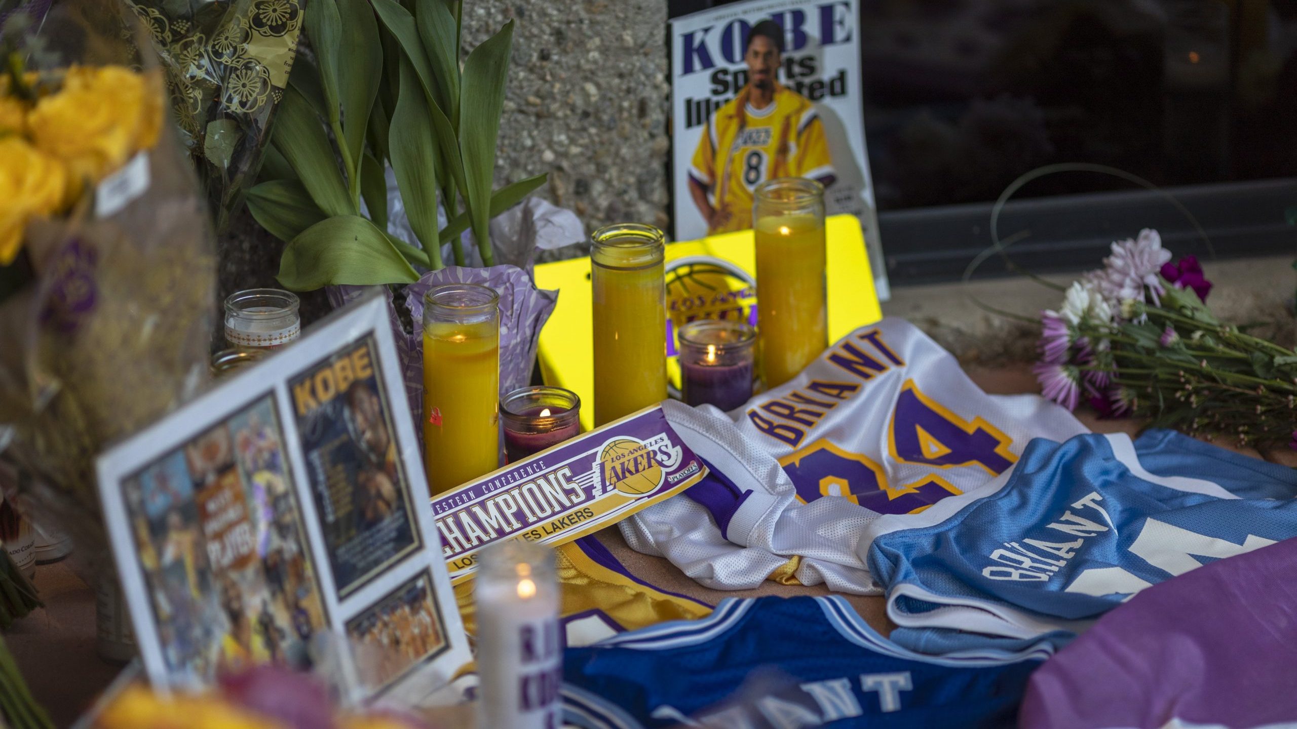 People mourn at a makeshift memorial at Mamba Sports Academy for former NBA great Kobe Bryant, who was killed in a helicopter crash while commuting to the academy on January 26, 2020 in Newbury Park, California. (Credit: David McNew/Getty Images)