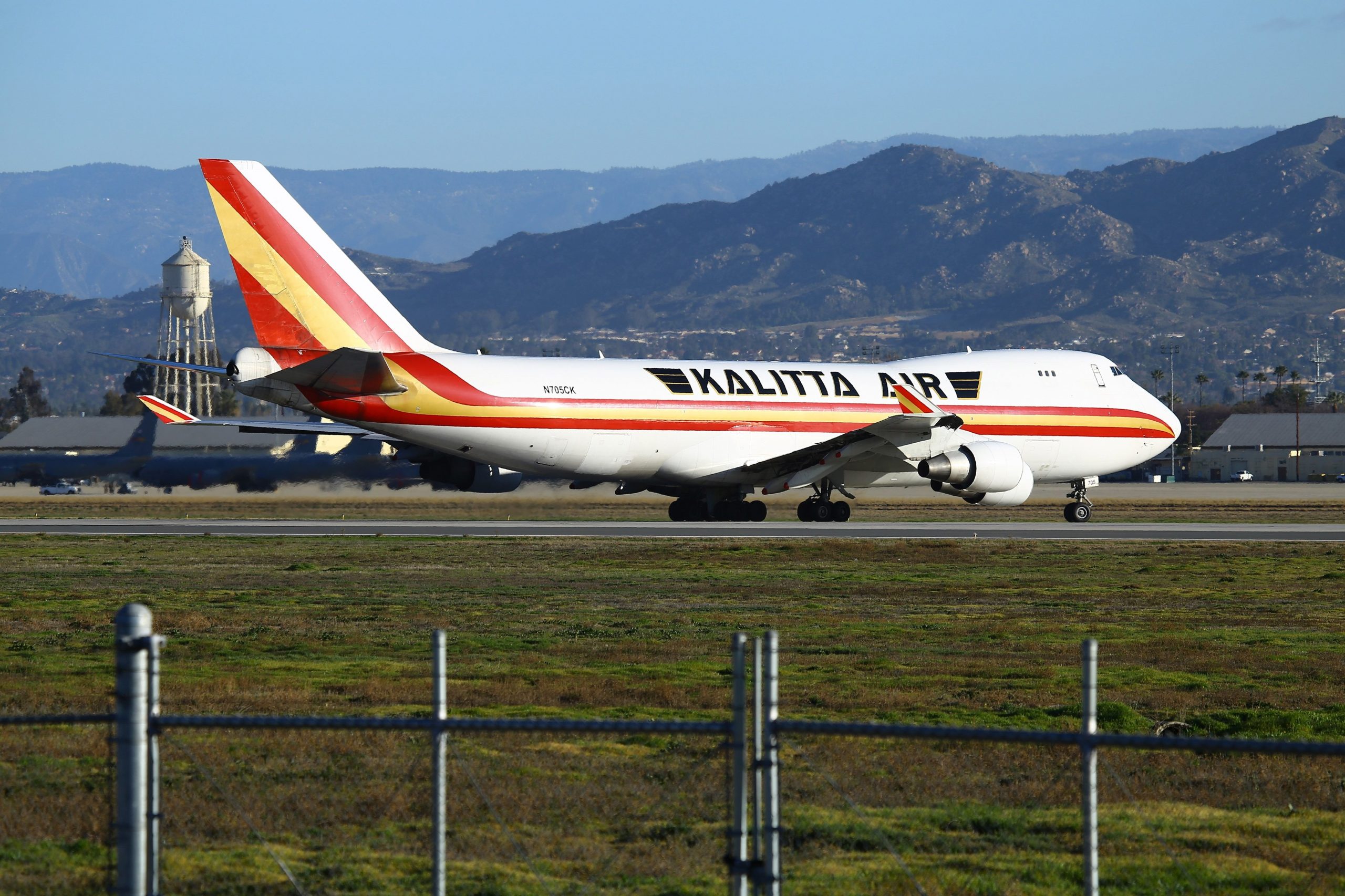 A charter plane lands at March Air Reserve Base in Riverside County on Jan. 29, 2020, with passengers evacuated from Wuhan, the Chinese city at the heart of a growing outbreak of the deadly 2019 novel coronavirus. (Credit: MATT HARTMAN/AFP via Getty Images)