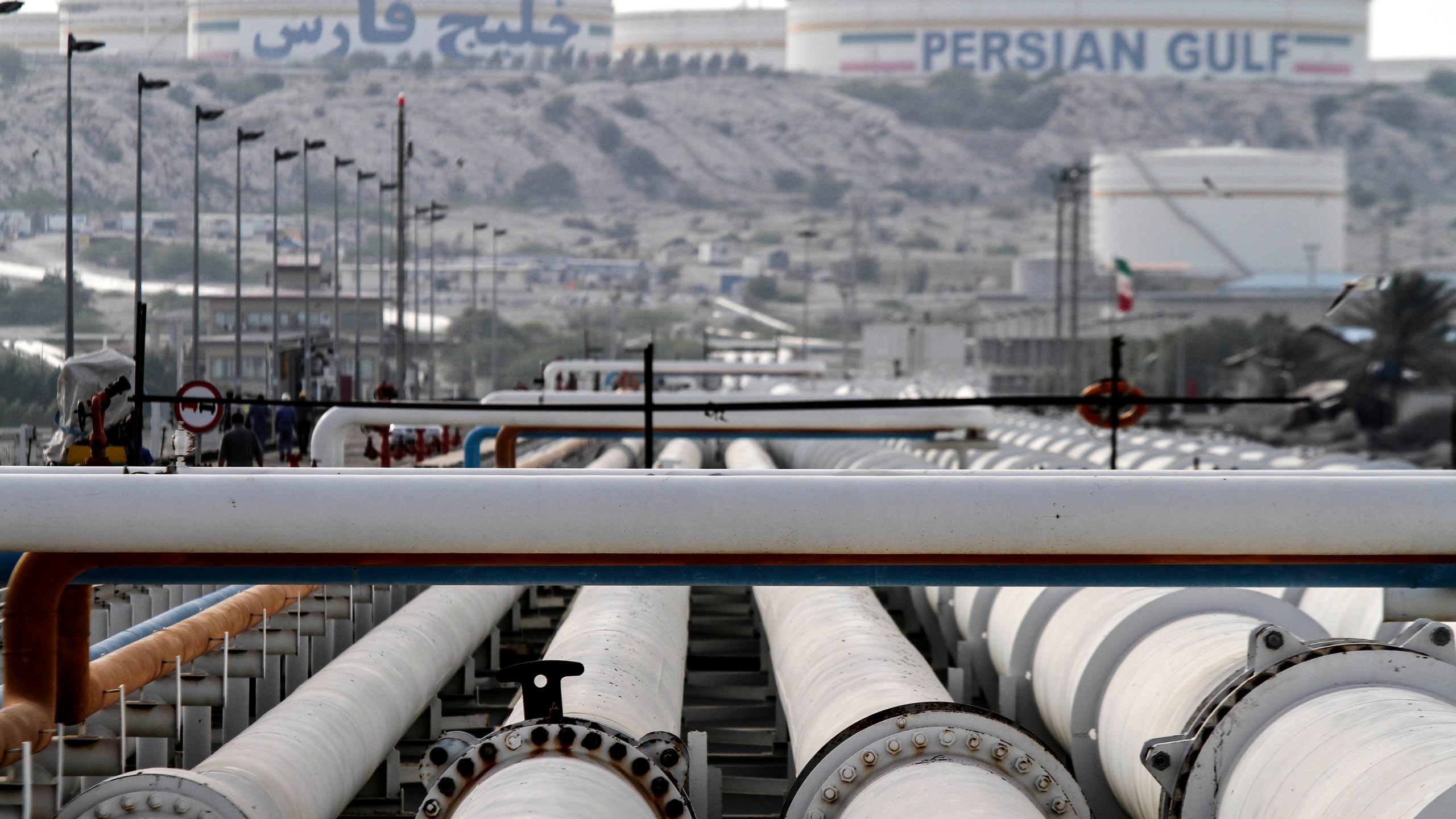 A picture shows export oil pipelines at an oil facility on Kharg Island, a continental island in the Persian Gulf belonging to Iran, on Feb. 23, 2016. (Credit: STR/AFP via Getty Images)