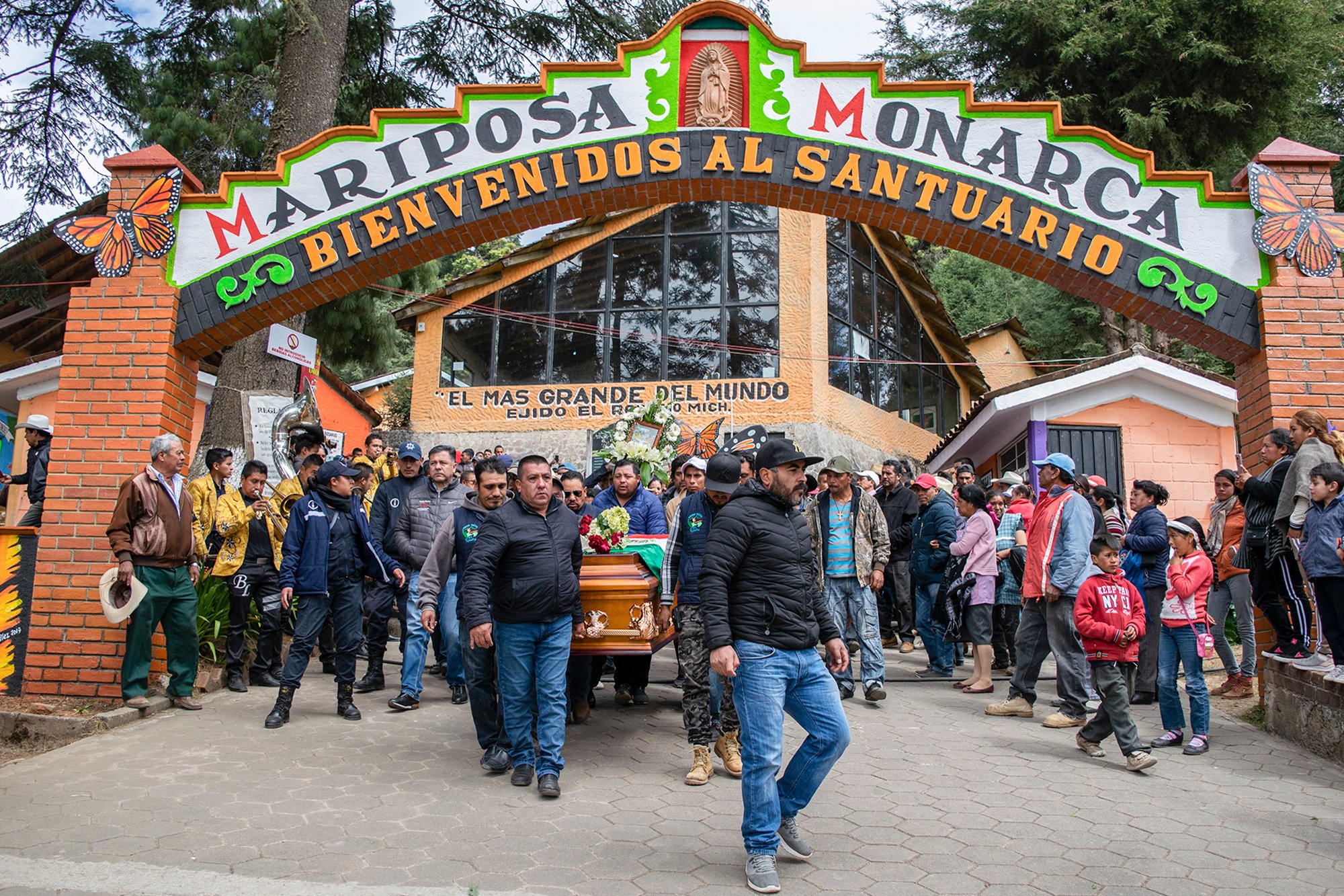 People carry the coffin with the remains of Mexican environmentalist Homero Gomez, during his funeral procession in El Rosario village, Ocampo municipality, Michoacan State, Mexico, on Jan. 30, 2020. (Credit: Enrique Castro / AFP)