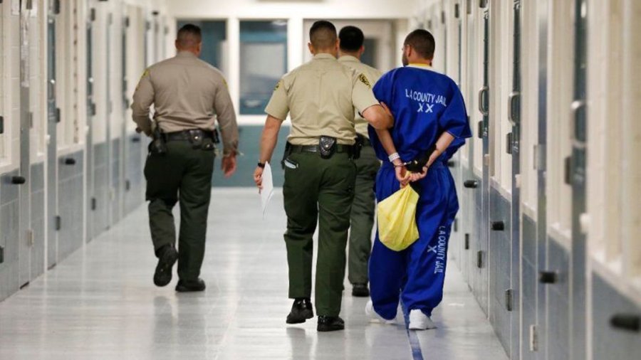 Deputies escort an inmate at Men’s Central Jail in Los Angeles in this undated photo. (Credit: Al Seib / Los Angeles Times)