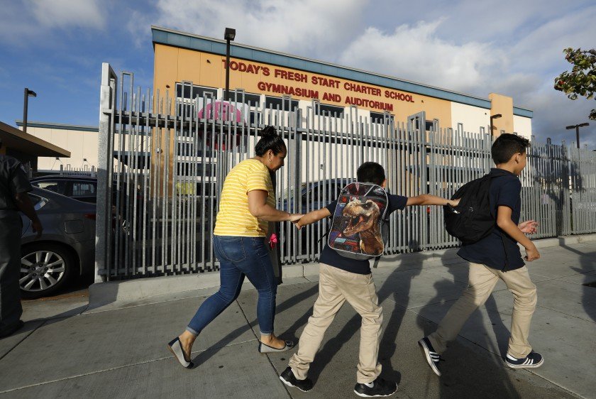 A parent and students walk by the Today's Fresh Start Charter School gym and auditorium in Inglewood in this undated photo. (Credit: Mel Melcon / Los Angeles TImes)