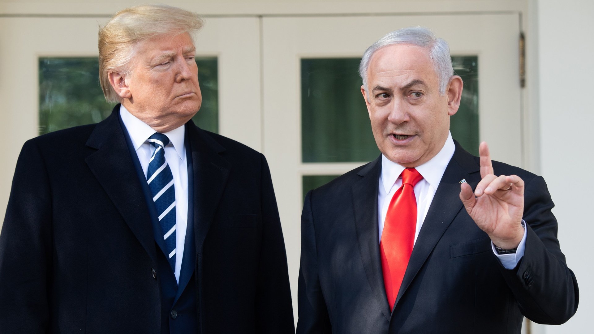 US President Donald Trump and Israeli Prime Minister Benjamin Netanyahu (R) speak to the press on the West Wing Colonnade prior to meetings at the White House in Washington, DC, January 27, 2020. (Credit: SAUL LOEB/AFP via Getty Images)