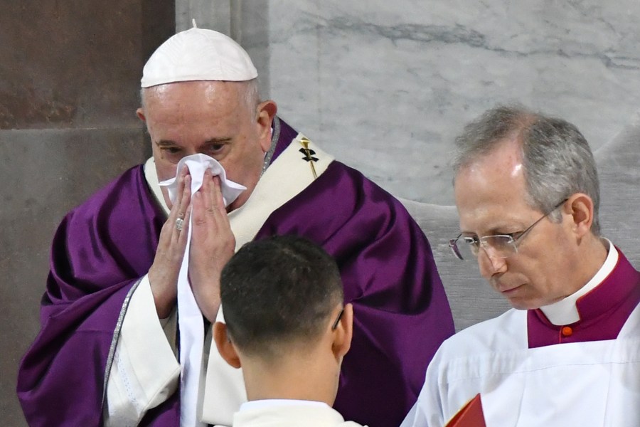 Pope Francis blows his nose as he leads the Ash Wednesday mass on February 26, 2020, at the Santa Sabina church in Rome. (ALBERTO PIZZOLI/AFP via Getty Images)