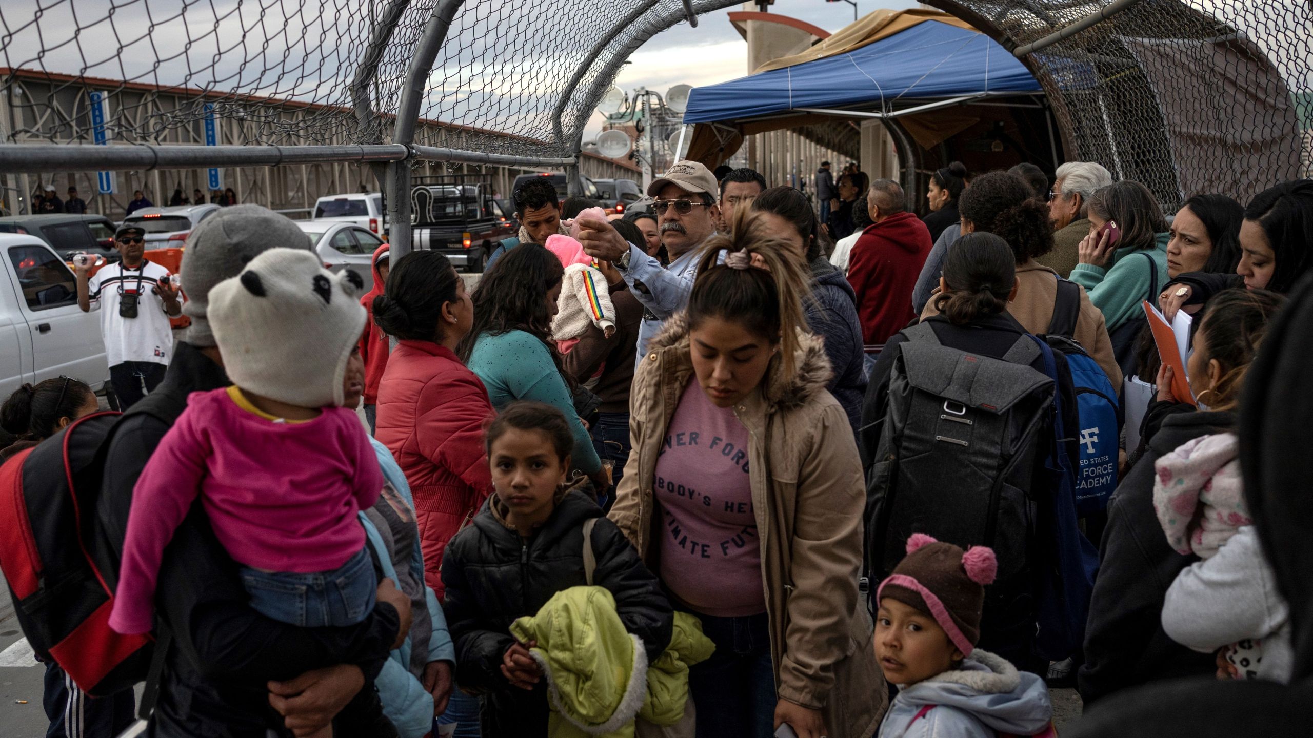 Migrants part of the Migrant Protection Protocols program are led back down Paso del Norte International Bridge after not being allowed to cross into the U.S. on February 28, 2020, in Ciudad Juárez. (PAUL RATJE/AFP via Getty Images)