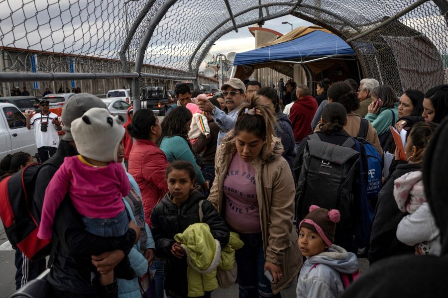 Migrants part of the Migrant Protection Protocols program are led back down Paso del Norte International Bridge after not being allowed to cross into the U.S. on February 28, 2020, in Ciudad Juárez. (PAUL RATJE/AFP via Getty Images)