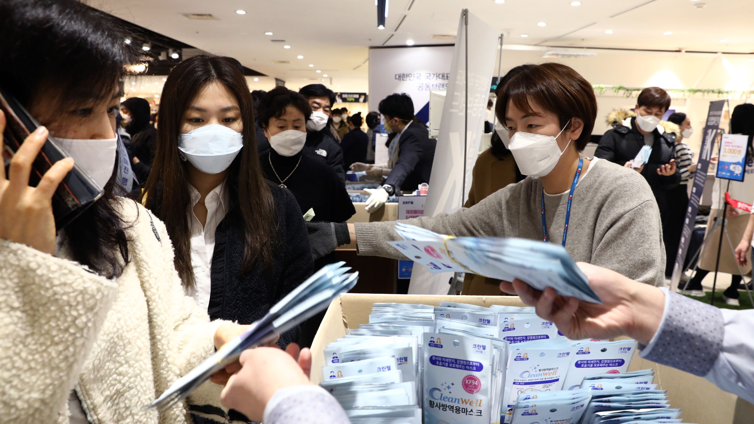 People wearing masks to prevent the coronavirus (COVID-19) buy face masks at a department store on February 28, 2020 in