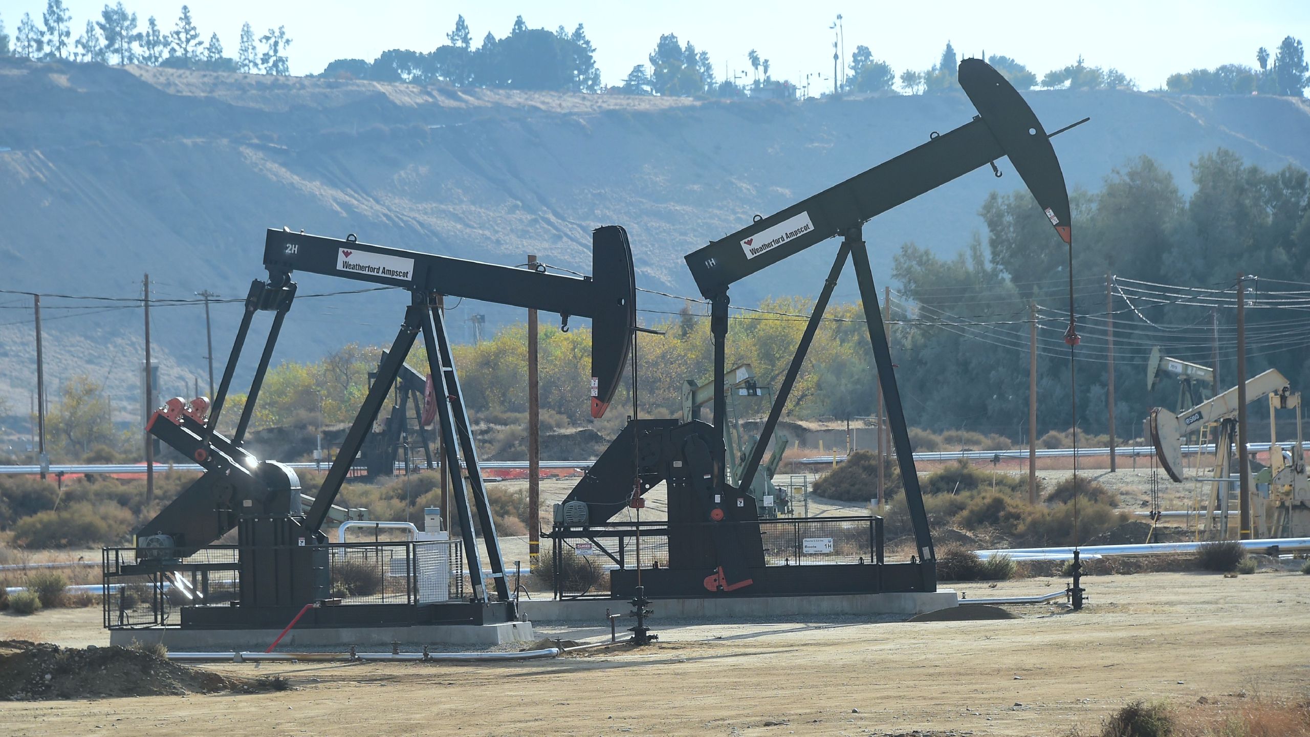 Oil derricks at the Chevron Oil Field in Bakersfield are seen on Nov. 21, 2016. (Frederic J. Brown / AFP / Getty Images)