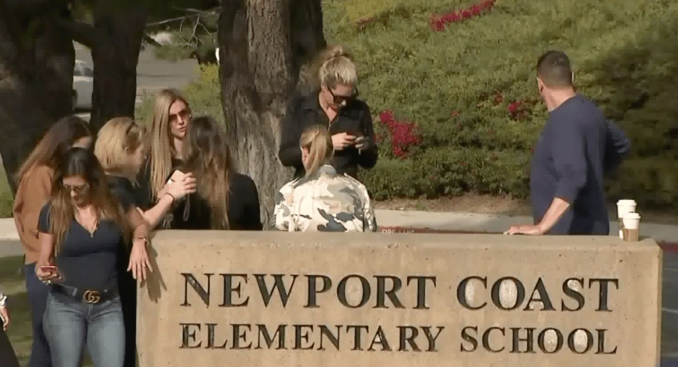 Concerned parents gather at Newport Coast Elementary on Feb. 28, 2020. (KTLA)