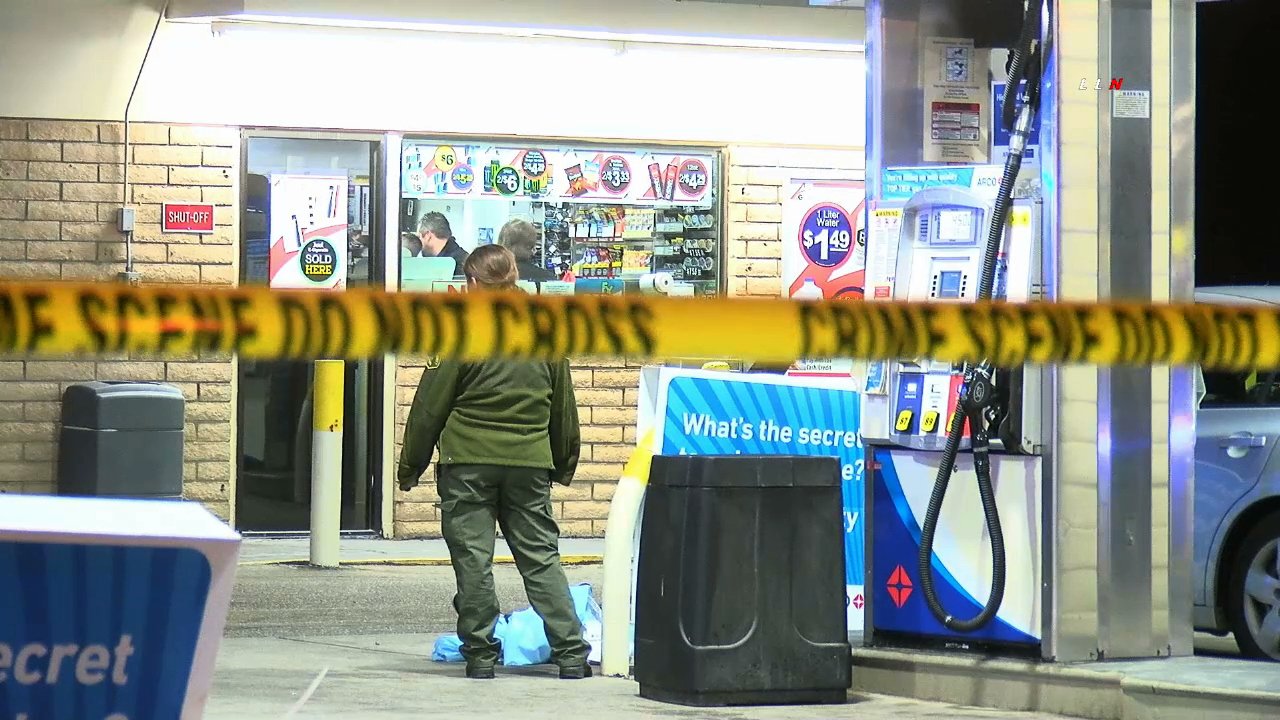 Officials respond to the scene where a man was fatally shot at an Arco gas station in Perris on Feb. 2, 2020. (Credit: LoudLabs)