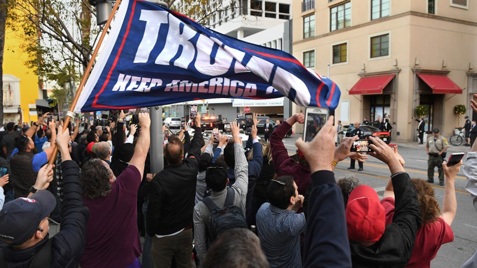 Trump supporters and protesters watch as the president arrives outside the Montage Hotel in Beverly Hills on Feb. 18, 2020.(Credit: Wally Skalij / Los Angeles Times)