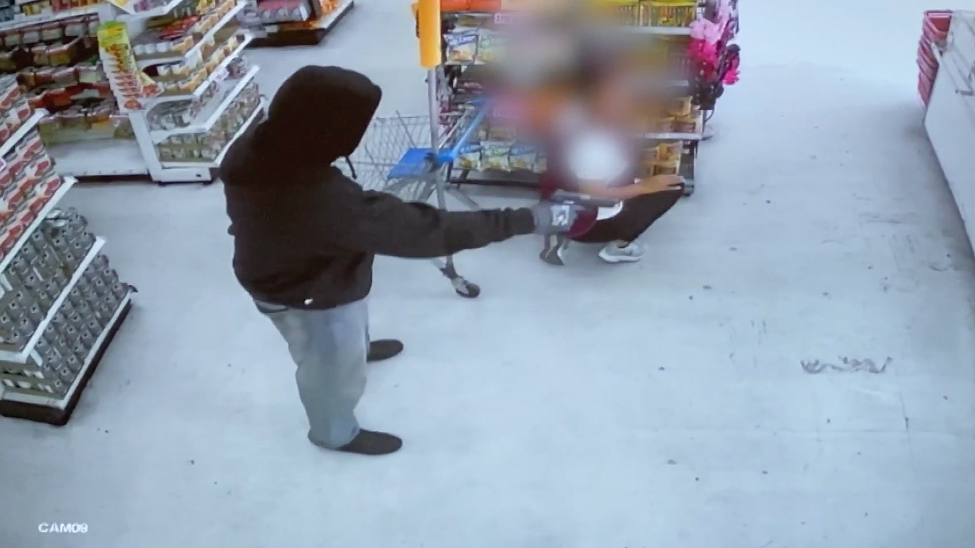 A gunman robbed the Dollar Max store, 3545 E. 1st Street in East Los Angeles, on Feb. 21, 2020, as pictured in this surveillance video obtained by KTLA.