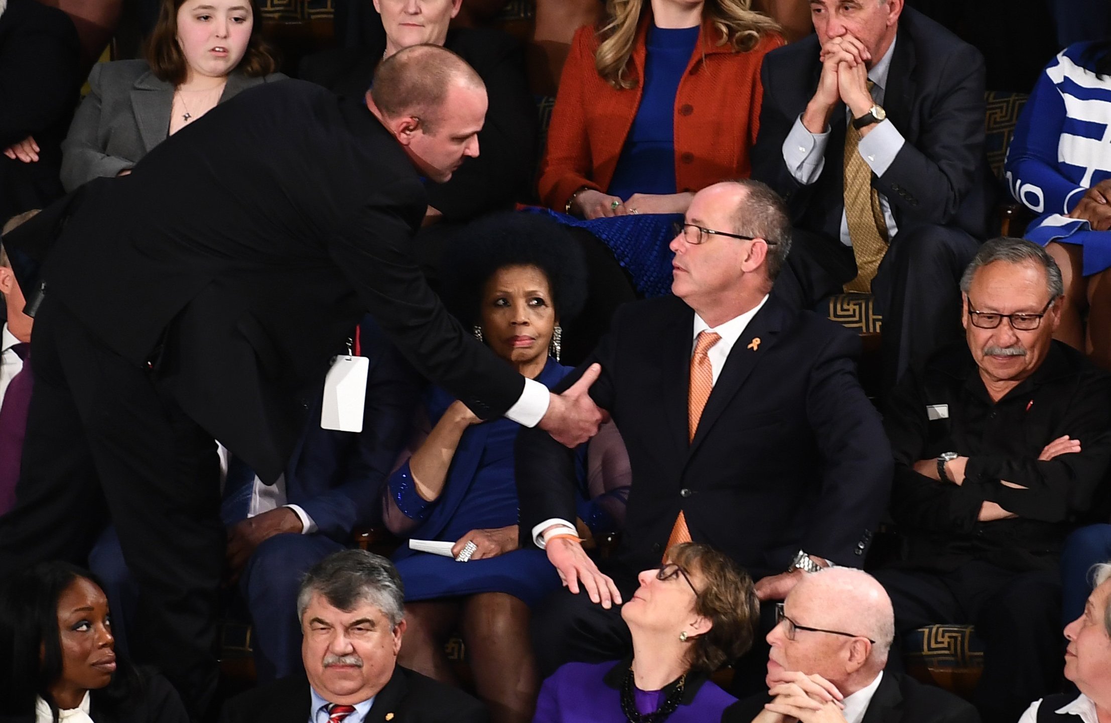 Fred Guttenberg (C), who lost his 14-year-old daughter in the Parkland, Florida, school shooting is removed after yelling during the State of the Union address at the US Capitol in Washington, DC, on February 4, 2020. (Credit: BRENDAN SMIALOWSKI/AFP via Getty Images)