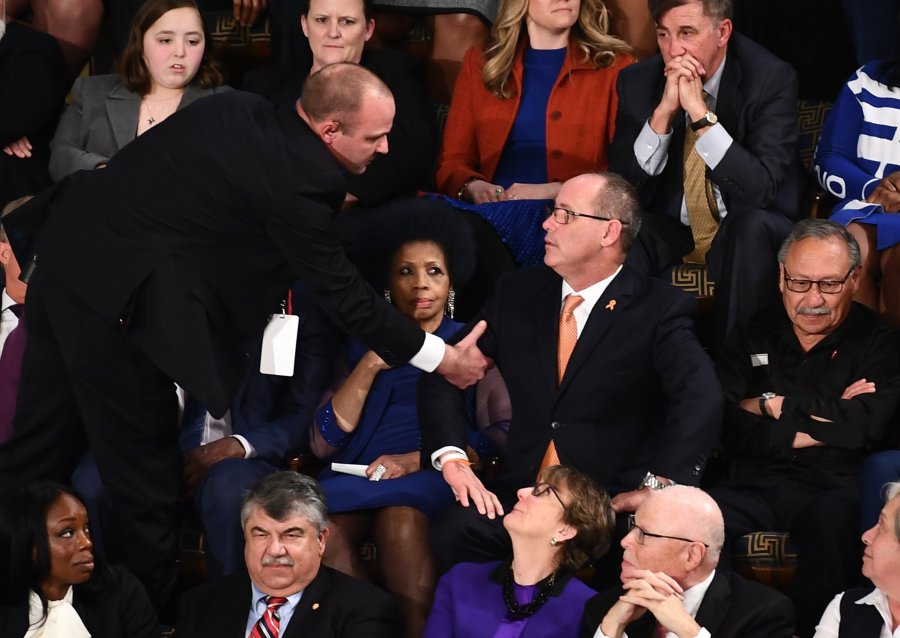 Fred Guttenberg (C), who lost his 14-year-old daughter in the Parkland, Florida, school shooting is removed after yelling during the State of the Union address at the US Capitol in Washington, DC, on February 4, 2020. (Credit: BRENDAN SMIALOWSKI/AFP via Getty Images)