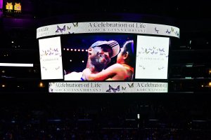 People arrive to attend the "Celebration of Life for Kobe and Gianna Bryant" service at Staples Center on Feb. 24, 2020. (Credit: FREDERIC J. BROWN/AFP via Getty Images)