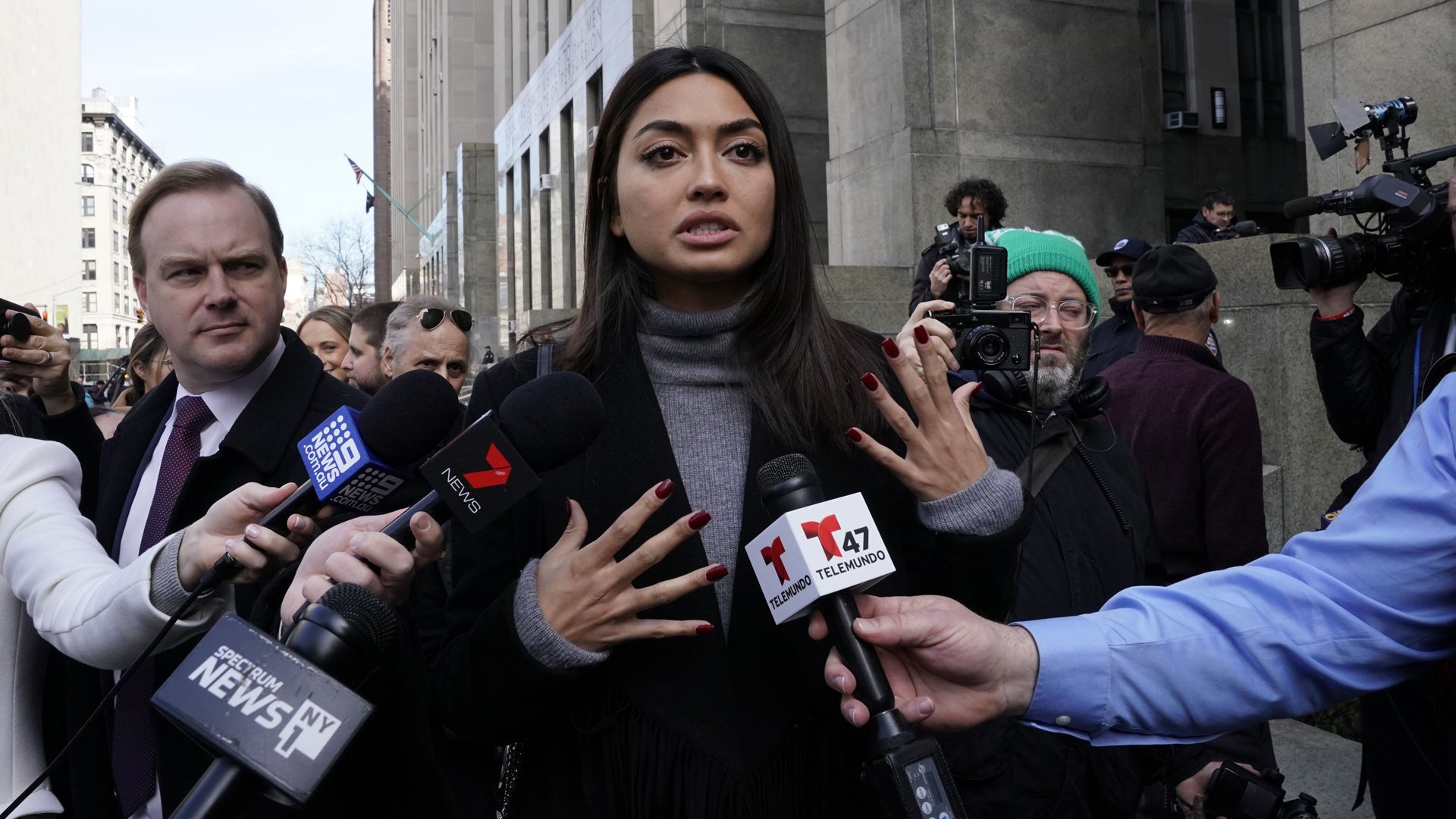 Ambra Battilana Gutierrez, an Italian-Filipina model who signed a million-dollar nondisclosure agreement with Harvey Weinstein, talks to press outside the Manhattan criminal courthouse after the producer was convicted on Feb. 24, 2020. (Credit: Timothy A. Clary / AFP / Getty Images)