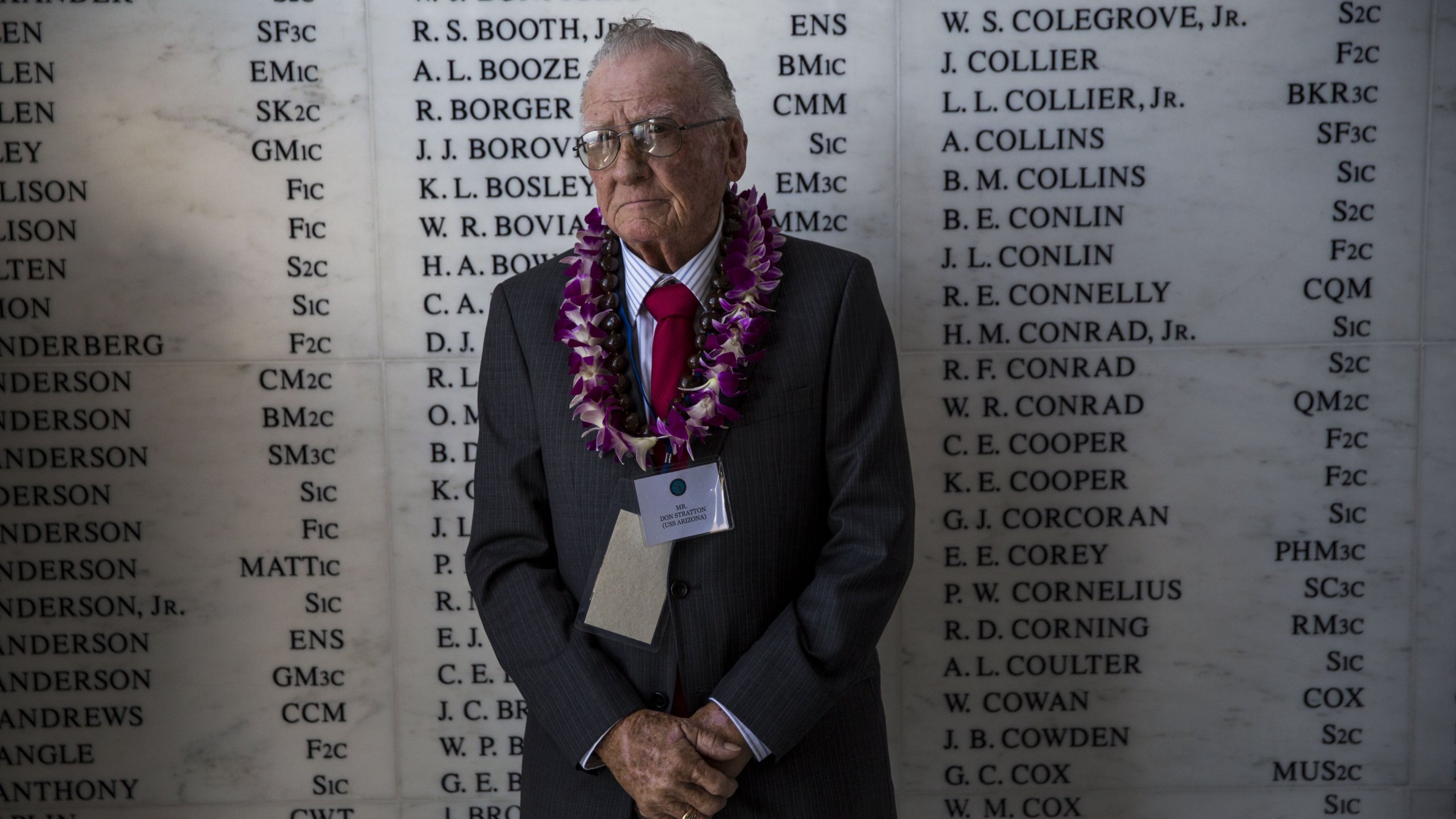 U.S.S. Arizona survivor Donald Stratton stands in front of the remembrance wall in the shrine room the U.S.S. Arizona Memorial during a memorial service for the 73rd anniversary of the attack on the U.S. naval base at Pearl harbor on the island of Oahu at the Pacific National Monument on December 07, 2014 in Pearl Harbor, Hawaii. (Credit: Kent Nishimura/Getty Images)