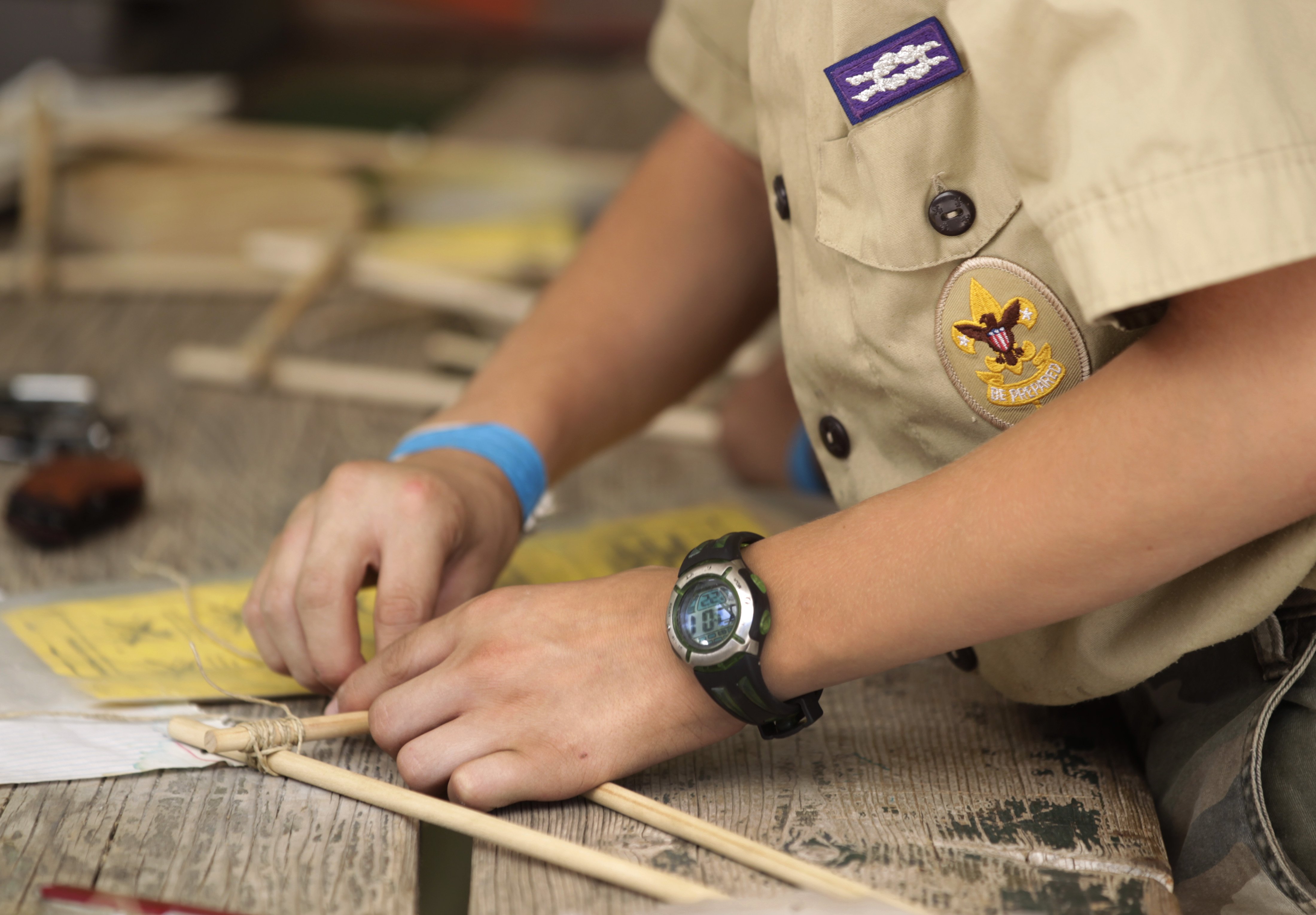 Boy Scouts work on a wood project at camp Maple Dell outside Payson, Utah, on July 31, 2015. (Credit: George Frey / Getty Images)