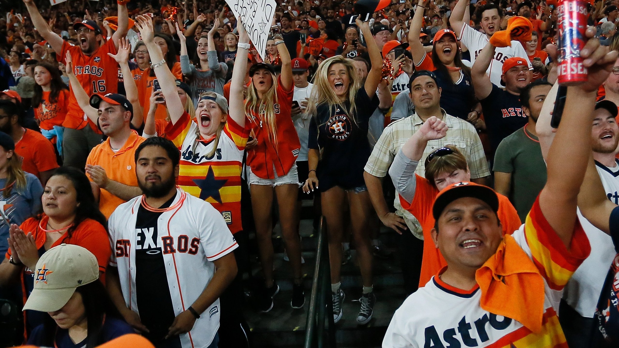 Houston fans celebrate after the Houston Astros defeated the Los Angeles Dodgers in Game 7 of the World Series during a Houston Astros World Series watch party at Minute Maid Park on Nov. 1, 2017, in Houston. (Credit: Bob Levey/Getty Images)