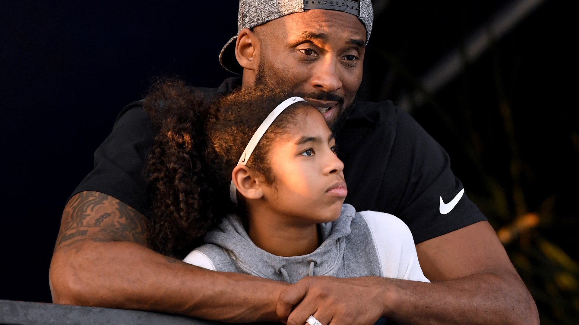 Kobe Bryant and daughter Gianna Bryant watch the Phillips 66 National Swimming Championships at the Woollett Aquatics Center on July 26, 2018 in Irvine. (Credit: Harry How/Getty Images)