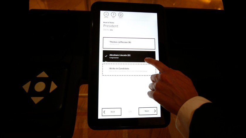 A 2020 image shows how Los Angeles County’s new voting machines require voters to use a touch-screen to make choices that are then printed on a paper ballot. (Credit: Barbara Davidson / Los Angeles Times)