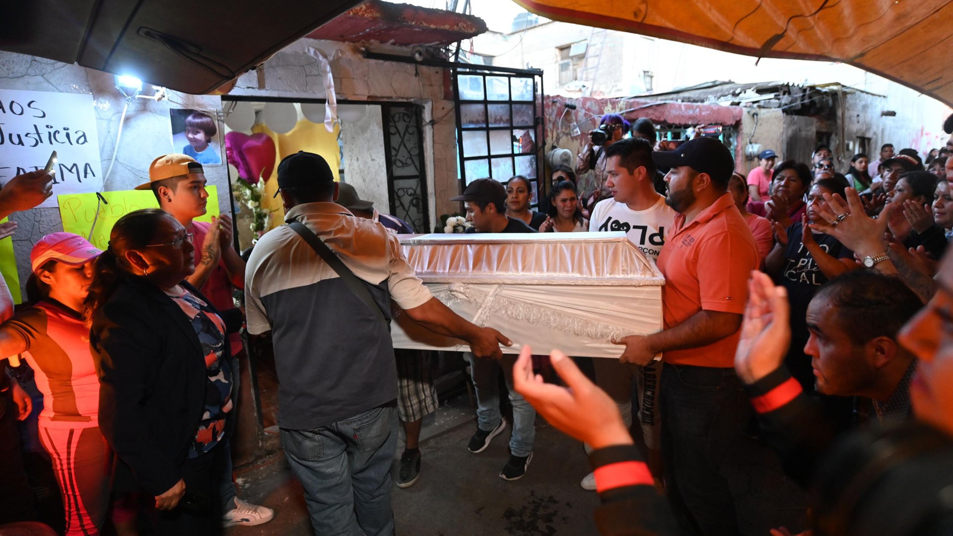 People carry the coffin during the funeral of 7-year-old Fátima, whose body was found over the weekend. (Credit: PEDRO PARDO/AFP/AFP via Getty Images)