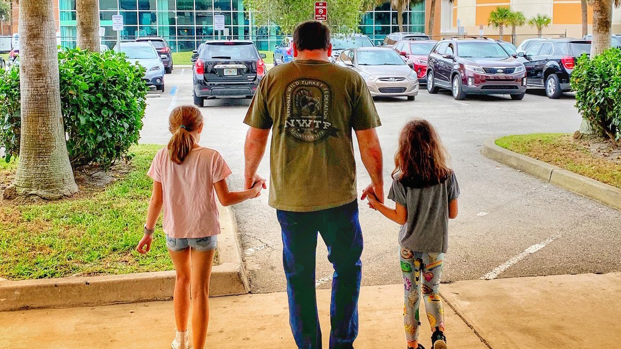 Randy Newman and his two daughters are seen in a photo distributed by the Tribune Media Wire.